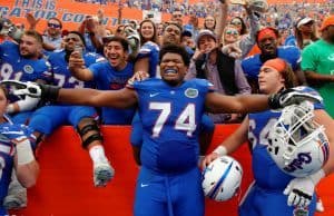 University of Florida offensive lineman Fred Johnson celebrates with his teammates and fans after the Florida Gators win over South Carolina in 2016- Florida Gators football- 1280x852