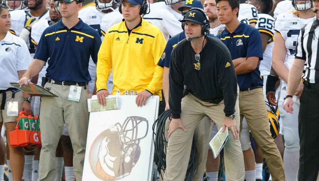 University of Michigan head football coach Jim Harbaugh watches his team beat Florida in the 2016 Buffalo Wild Wings Bowl- Florida Gators football- 1280x852