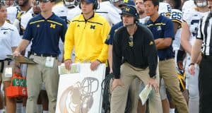 University of Michigan head football coach Jim Harbaugh watches his team beat Florida in the 2016 Buffalo Wild Wings Bowl- Florida Gators football- 1280x852