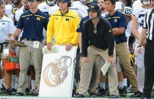 University of Michigan head football coach Jim Harbaugh watches his team beat Florida in the 2016 Buffalo Wild Wings Bowl- Florida Gators football- 1280x852