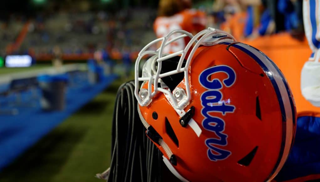 A Florida Gators helmet rests on a fence during the 2017 Orange and Blue Debut- Florida Gators football- 1280x852