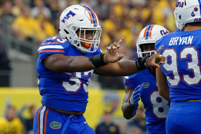 Florida Gators linebacker David Reese makes a tackle against Michigan-1280x853