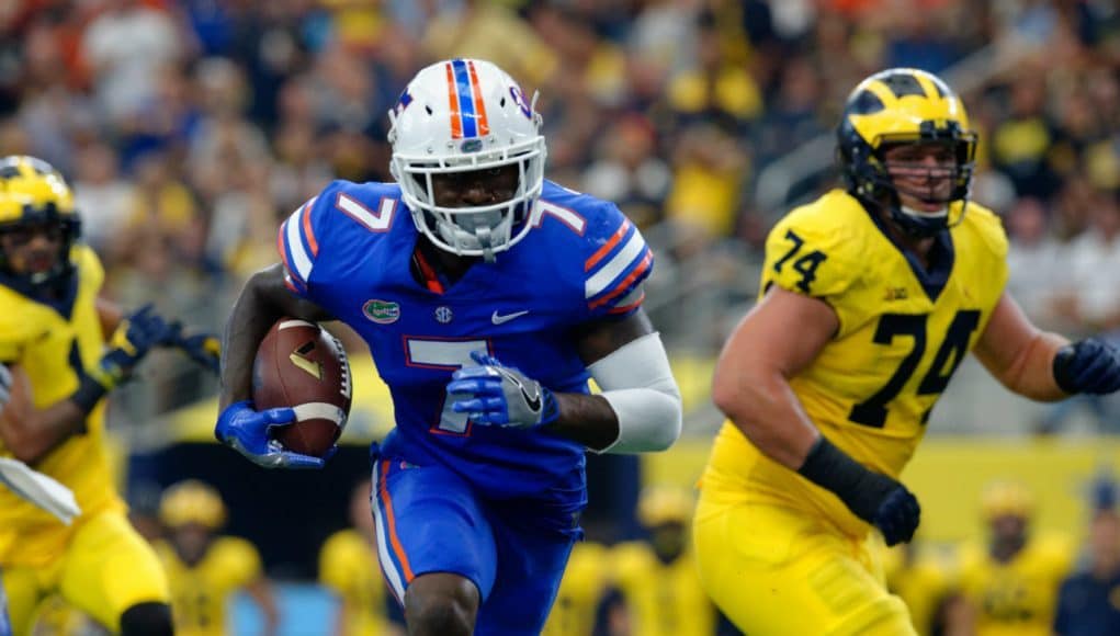 University of Florida defensive back Duke Dawson returns an interception 48-yards for a touchdown against Michigan- Florida Gators football- 1280x852