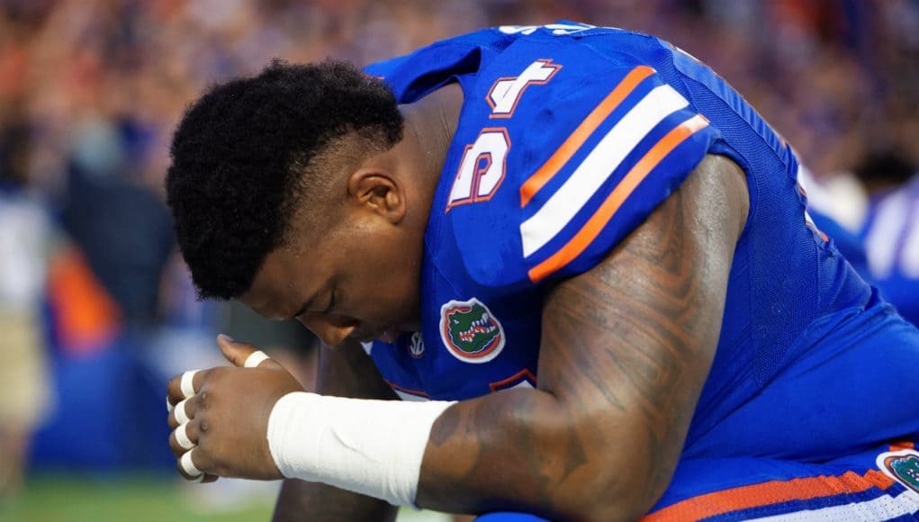 University of Florida defensive tackle Khairi Clark prays before the Florida Gators season opener against UMass in 2016- Florida Gators football- 1280x854