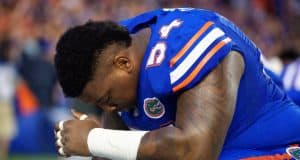 University of Florida defensive tackle Khairi Clark prays before the Florida Gators season opener against UMass in 2016- Florida Gators football- 1280x854