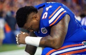 University of Florida defensive tackle Khairi Clark prays before the Florida Gators season opener against UMass in 2016- Florida Gators football- 1280x854