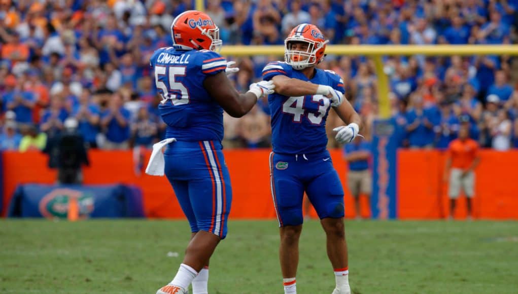 University of Florida linebacker Cristian Garcia and defensive lineman Kyree Campbell celebrate after a tackle against Tennessee- Florida Gators football- 1280x852