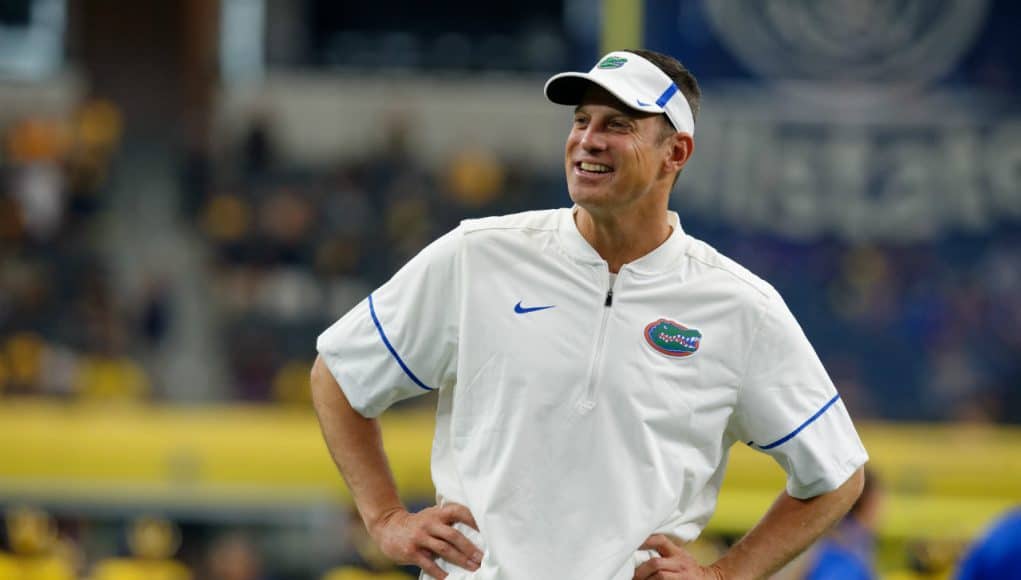 University of Florida offensive coordinator Doug Nussmeier watches the Florida Gators warm up prior to their game vs Michigan- Florida Gators football- 1280x852