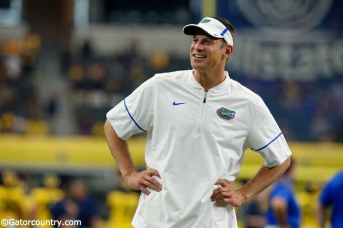 University of Florida offensive coordinator Doug Nussmeier watches the Florida Gators warm up prior to their game vs Michigan- Florida Gators football- 1280x852