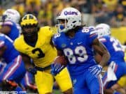 University of Florida receiver Tyrie Cleveland runs after a reception while Michigan’s Rashan Gary chases- Florida Gators football- 1280x852