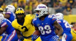 University of Florida receiver Tyrie Cleveland runs after a reception while Michigan’s Rashan Gary chases- Florida Gators football- 1280x852