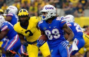 University of Florida receiver Tyrie Cleveland runs after a reception while Michigan’s Rashan Gary chases- Florida Gators football- 1280x852