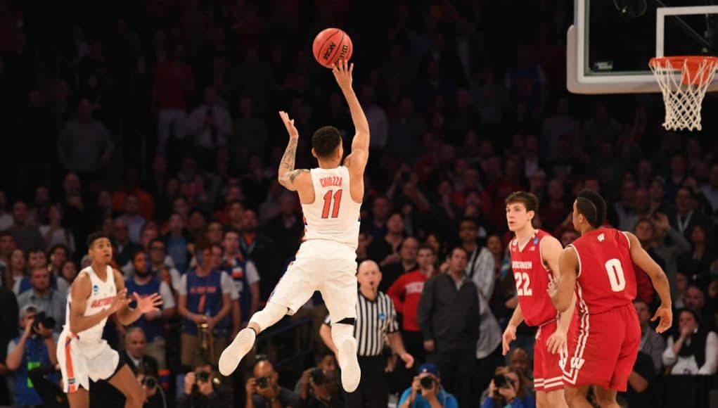 Mar 24, 2017; New York, NY, USA; Florida Gators guard Chris Chiozza (11) makes a three point basket to beat the Wisconsin Badgers in overtime in the semifinals of the East Regional of the 2017 NCAA Tournament at Madison Square Garden. Mandatory Credit: Robert Deutsch-USA TODAY Sports