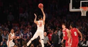 Mar 24, 2017; New York, NY, USA; Florida Gators guard Chris Chiozza (11) makes a three point basket to beat the Wisconsin Badgers in overtime in the semifinals of the East Regional of the 2017 NCAA Tournament at Madison Square Garden. Mandatory Credit: Robert Deutsch-USA TODAY Sports