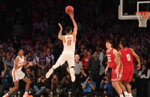 Mar 24, 2017; New York, NY, USA; Florida Gators guard Chris Chiozza (11) makes a three point basket to beat the Wisconsin Badgers in overtime in the semifinals of the East Regional of the 2017 NCAA Tournament at Madison Square Garden. Mandatory Credit: Robert Deutsch-USA TODAY Sports