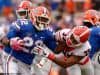 University of Florida running back Lamical Perine stiff arms a Georgia defender- Florida Gators football- 1280x852