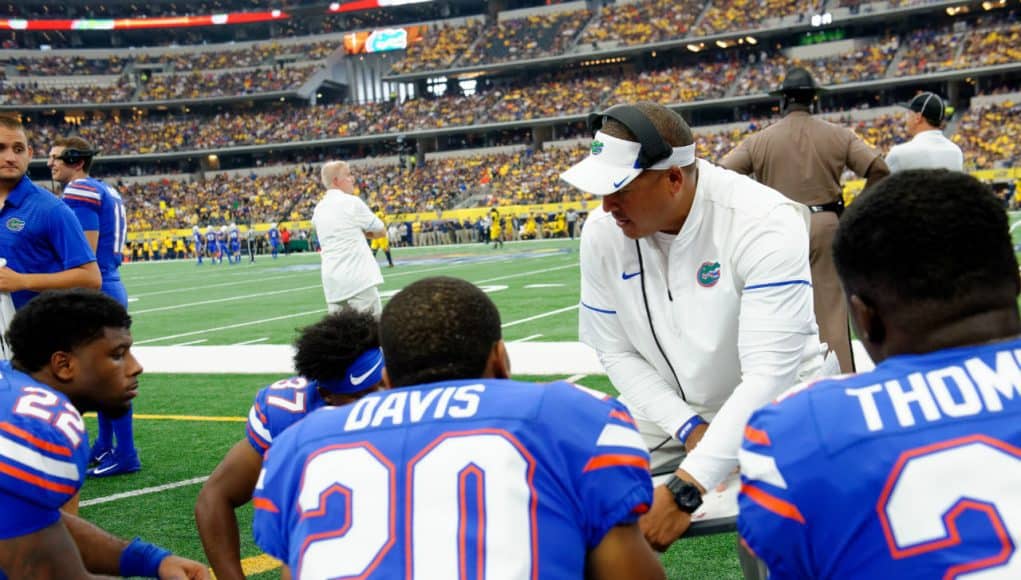 University of Florida running backs coach Ja’Juan Seider coaches his players during the Florida Gators game against the Michigan Wolverines- Florida Gators football- 1280x852