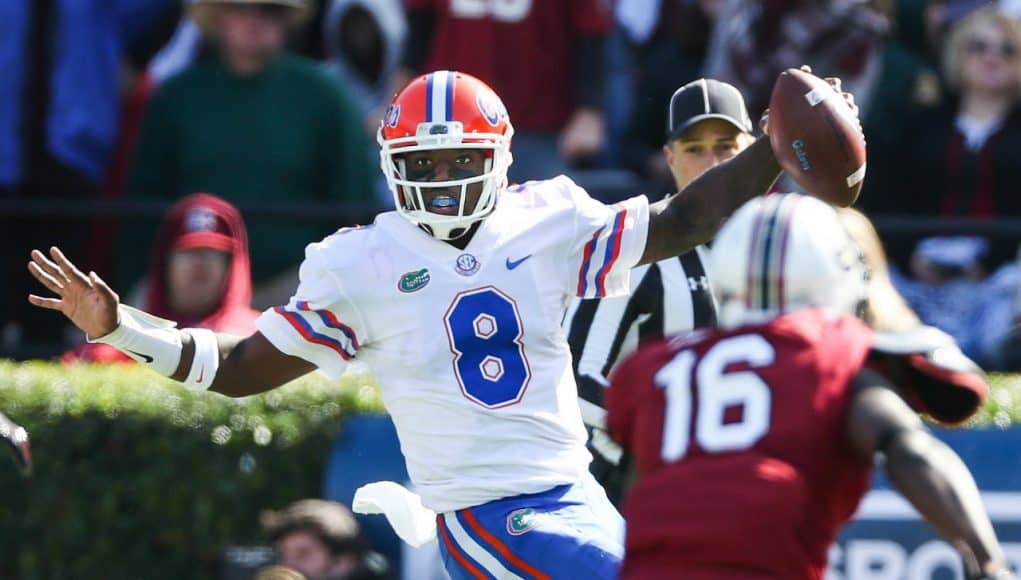 Nov 11, 2017; Columbia, SC, USA; Florida Gators quarterback Malik Zaire (8) scrambles as South Carolina Gamecocks defensive back Rashad Fenton (16) gives chase during the second quarter at Williams-Brice Stadium. Mandatory Credit: Jim Dedmon-USA TODAY Sports