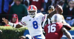 Nov 11, 2017; Columbia, SC, USA; Florida Gators quarterback Malik Zaire (8) scrambles as South Carolina Gamecocks defensive back Rashad Fenton (16) gives chase during the second quarter at Williams-Brice Stadium. Mandatory Credit: Jim Dedmon-USA TODAY Sports