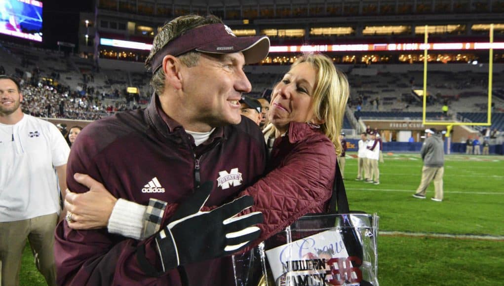 Nov 26, 2016; Oxford, MS, USA; Mississippi State Bulldogs head coach Dan Mullen is embraced by his wife Megan Mullen after the game against the Mississippi Rebels at Vaught-Hemingway Stadium. Mississippi State won 55-20 Mandatory Credit: Matt Bush-USA TODAY Sports