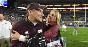 Nov 26, 2016; Oxford, MS, USA; Mississippi State Bulldogs head coach Dan Mullen is embraced by his wife Megan Mullen after the game against the Mississippi Rebels at Vaught-Hemingway Stadium. Mississippi State won 55-20 Mandatory Credit: Matt Bush-USA TODAY Sports