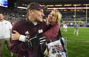 Nov 26, 2016; Oxford, MS, USA; Mississippi State Bulldogs head coach Dan Mullen is embraced by his wife Megan Mullen after the game against the Mississippi Rebels at Vaught-Hemingway Stadium. Mississippi State won 55-20 Mandatory Credit: Matt Bush-USA TODAY Sports