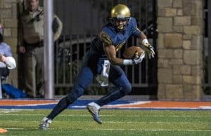 Sep 30, 2016; Las Vegas , NV, USA; St. Thomas Aquinas Raiders wide receiver Trevon Grimes (16) runs with the ball against the Bishop Gorman Gaels during the second quarter at Fertitta Field. Mandatory Credit: Joshua Dahl-USA TODAY Sports