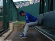 University of Florida pitcher Brady Singer sits alone in the bullpen before his start against the LSU Tigers in the College World Series- Florida Gators baseball- 1280x850