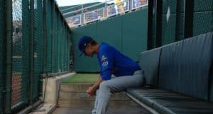 University of Florida pitcher Brady Singer sits alone in the bullpen before his start against the LSU Tigers in the College World Series- Florida Gators baseball- 1280x850