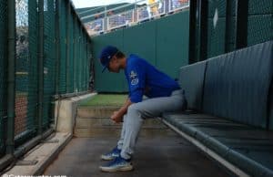 University of Florida pitcher Brady Singer sits alone in the bullpen before his start against the LSU Tigers in the College World Series- Florida Gators baseball- 1280x850