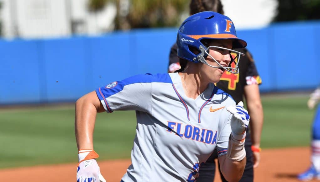 Florida Gators infielder Nicole DeWitt scores against Maryland- 1280x852