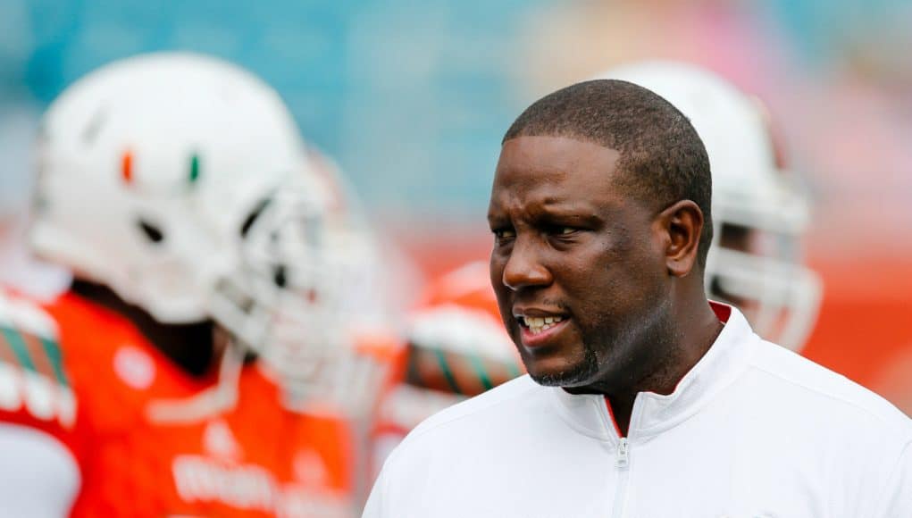 Nov 21, 2015; Miami Gardens, FL, USA; Miami Hurricanes interim head coach Larry Scott talks with his players before a game against the Georgia Tech Yellow Jackets at Sun Life Stadium. Mandatory Credit: Steve Mitchell-USA TODAY Sports