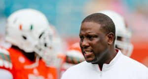 Nov 21, 2015; Miami Gardens, FL, USA; Miami Hurricanes interim head coach Larry Scott talks with his players before a game against the Georgia Tech Yellow Jackets at Sun Life Stadium. Mandatory Credit: Steve Mitchell-USA TODAY Sports