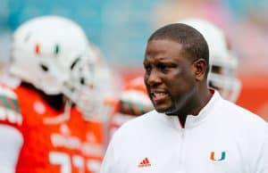 Nov 21, 2015; Miami Gardens, FL, USA; Miami Hurricanes interim head coach Larry Scott talks with his players before a game against the Georgia Tech Yellow Jackets at Sun Life Stadium. Mandatory Credit: Steve Mitchell-USA TODAY Sports