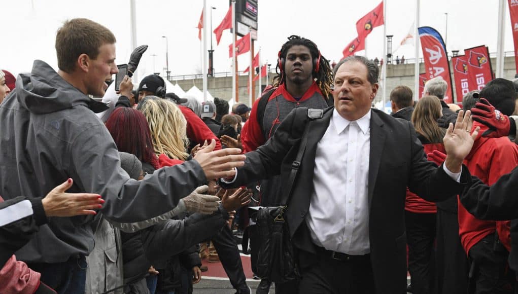 Nov 26, 2016; Louisville, KY, USA; Louisville Cardinals defensive coordinator Todd Grantham greets fans during the Card March before facing the Kentucky Wildcats at Papa John's Cardinal Stadium. Mandatory Credit: Jamie Rhodes-USA TODAY Sports