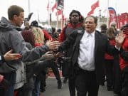 Nov 26, 2016; Louisville, KY, USA; Louisville Cardinals defensive coordinator Todd Grantham greets fans during the Card March before facing the Kentucky Wildcats at Papa John's Cardinal Stadium. Mandatory Credit: Jamie Rhodes-USA TODAY Sports