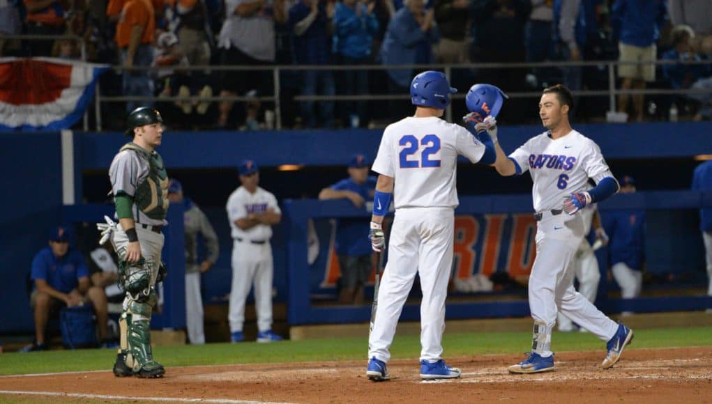 University of Florida third baseman Jonathan India is congratulated by JJ Schwarz after India’s fourth inning home run against Siena- Florida Gators baseball- 1280x853