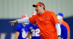 University of Florida head football coach Dan Mullen yells instructions while his football team stretches before football practice begins- Florida Gators baseball- 1280x853