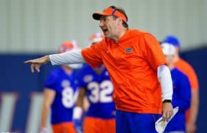 University of Florida head football coach Dan Mullen yells instructions while his football team stretches before football practice begins- Florida Gators baseball- 1280x853