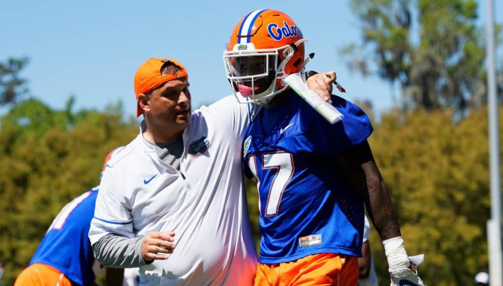 University of Florida receivers coach Billy Gonzales walks with his arm around Kadarius Toney during spring football camp- Florida Gators football- 1280x853