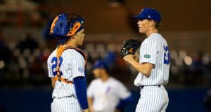 University of Florida pitcher Jack Leftwich and catcher JJ Schwarz meet at the mound in a win over the Florida State Seminoles- Florida Gators baseball- 1280x853