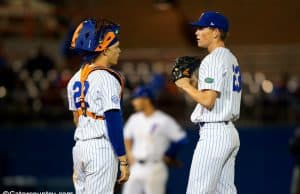 University of Florida pitcher Jack Leftwich and catcher JJ Schwarz meet at the mound in a win over the Florida State Seminoles- Florida Gators baseball- 1280x853