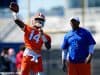 University of Florida quarterback Emory Jones throws a pass while quarterbacks coach Brian Johnson looks on- Florida Gators football- 1280x853