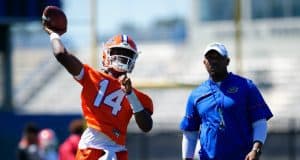 University of Florida quarterback Emory Jones throws a pass while quarterbacks coach Brian Johnson looks on- Florida Gators football- 1280x853