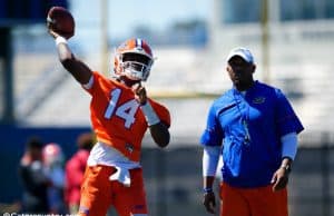 University of Florida quarterback Emory Jones throws a pass while quarterbacks coach Brian Johnson looks on- Florida Gators football- 1280x853