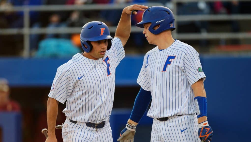 University of Florida seniors Nick Horvath and JJ Schwarz celebrate after Horvath scored a run- Florida Gators baseball- 1280x853