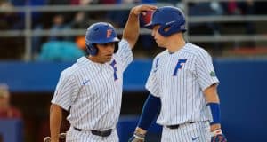 University of Florida seniors Nick Horvath and JJ Schwarz celebrate after Horvath scored a run- Florida Gators baseball- 1280x853