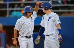 University of Florida seniors Nick Horvath and JJ Schwarz celebrate after Horvath scored a run- Florida Gators baseball- 1280x853