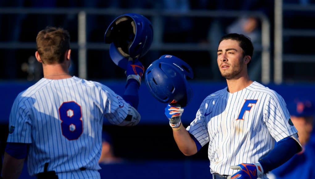 Deacon Liput congratulates University of Florida third baseman Jonathan India after a home run against Florida State- Florida Gators baseball- 1280x853