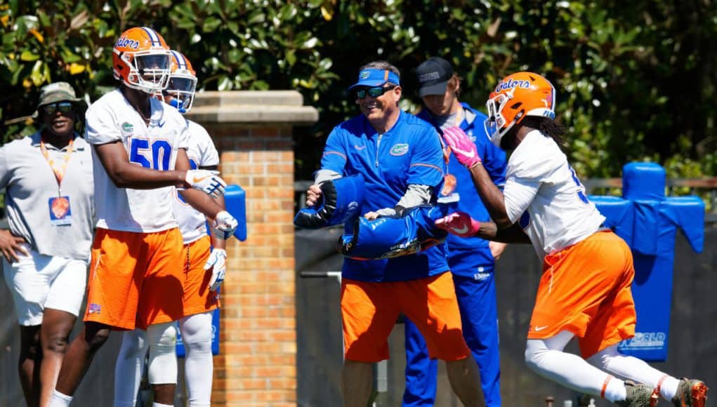 University of Florida defensive coordinator Todd Grantham goes through drills with the Gators defensive ends during spring camp- Florida Gators football- 1820x853